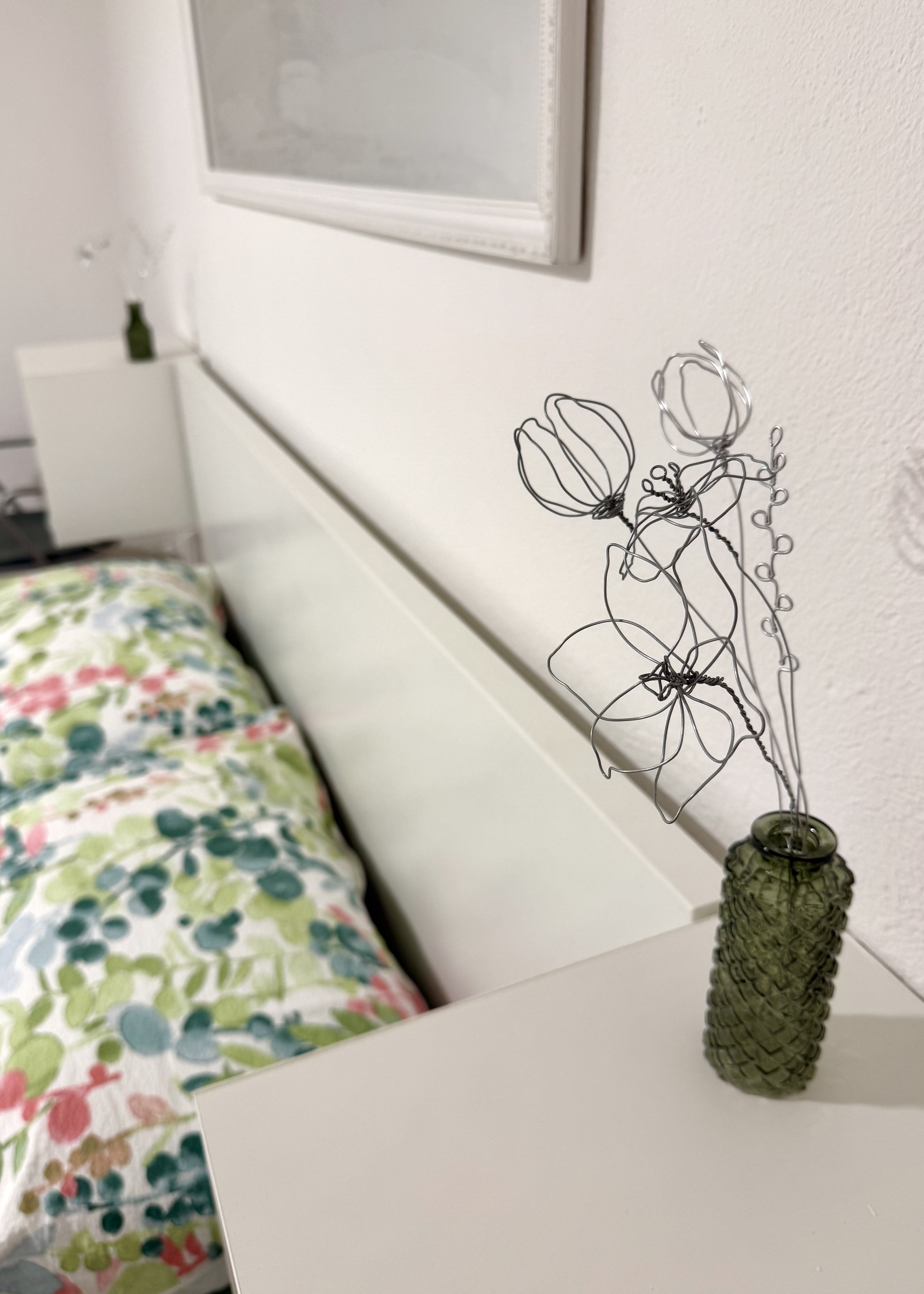 Wire flower detail on the bedside table