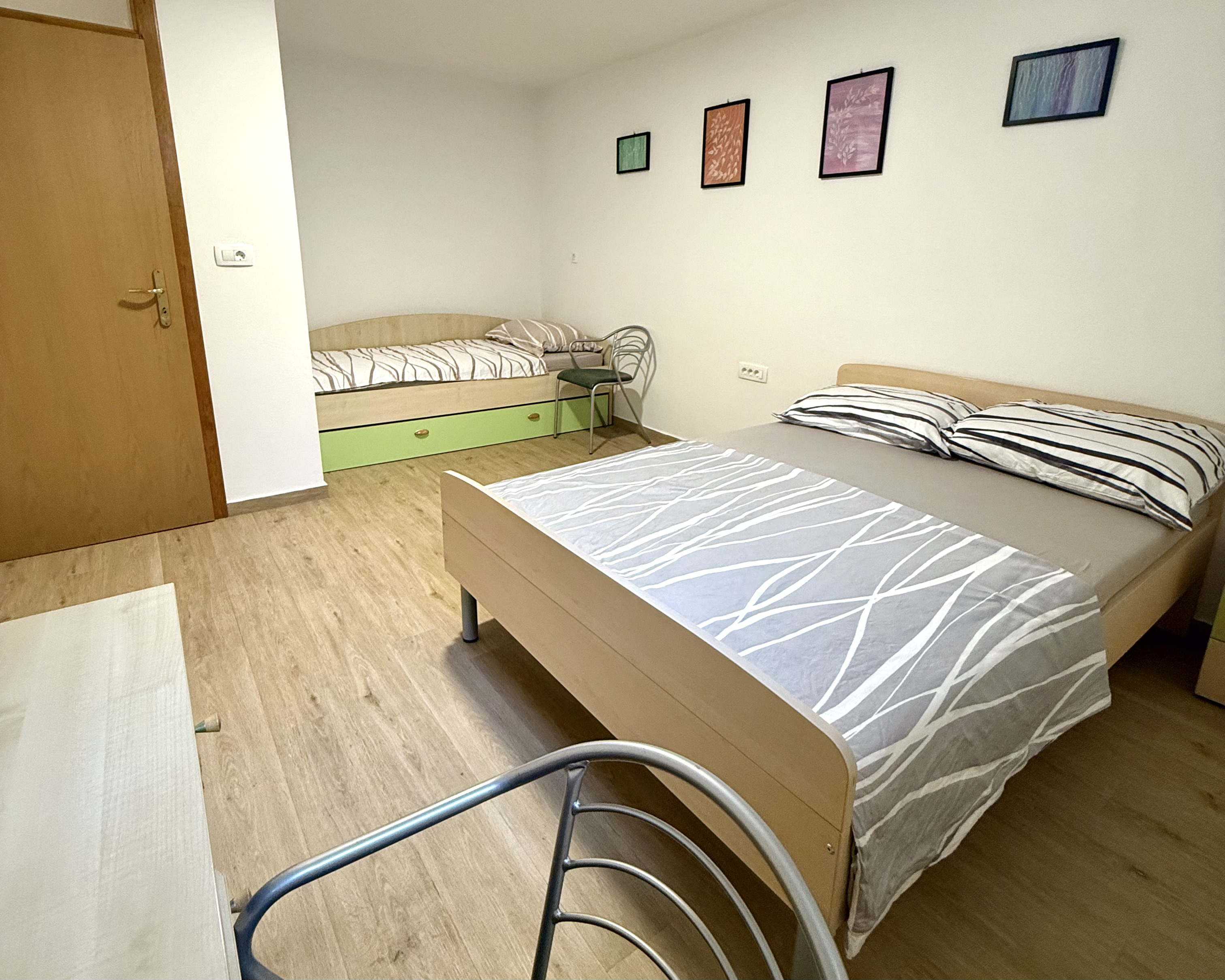 Second bedroom with double bed and extra single bed